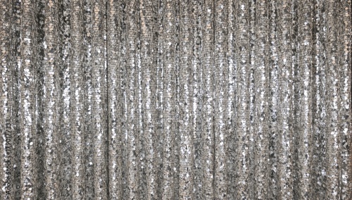 Silver sequin drapes serve as curtains and backdrops, reflecting light with a glossy finish, ideal for editorial header backgrounds