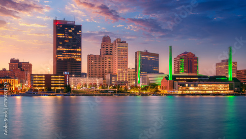 Toledo, Ohio, USA. Cityscape image of downtown Toledo, Ohio with reflection of the skyline in calm Maumee River at beautiful autumn sunset.