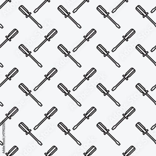 Cartoon doodle screwdriver seamless pattern. Vector illustration