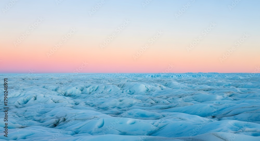 Fototapeta premium Expansive frozen plain under pastel dawn hues, creating a tranquil aesthetic suited for branding, wallpapers, or meditative visuals.