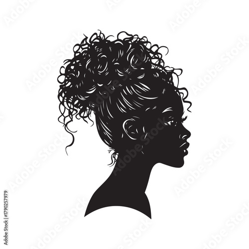 Elegant Silhouette of a Woman with Curly Hair in a Messy Bun