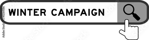 Search banner in word winter campaign with hand over magnifier icon on white background