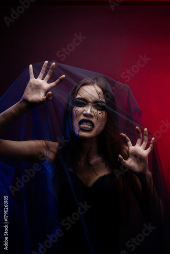 Dark fashion portrait of Asian woman