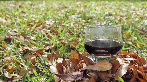 Drip coffee on the autumn morning grass