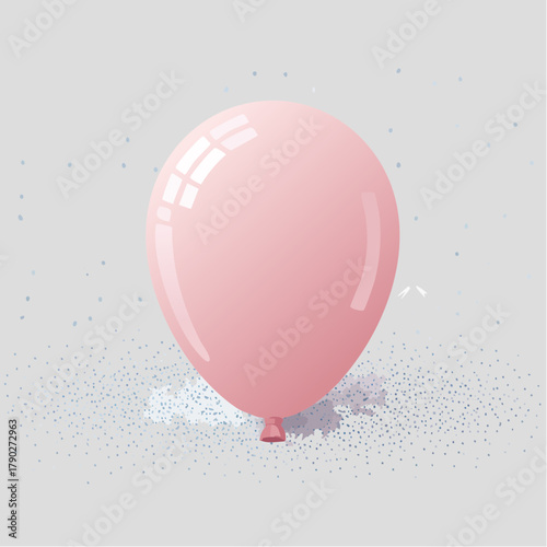 A deflated balloon resting on a blank, flat surface surrounded by faint specks of glitter.