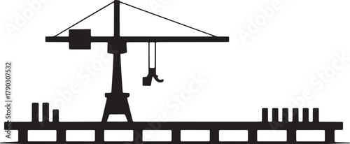 Silhouette of Construction Crane Lifting Heavy Materials With Hooks on Dock Background
