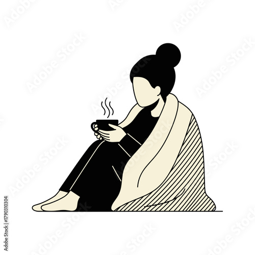 Woman sitting with a cup of tea wrapped in a blanket at home  