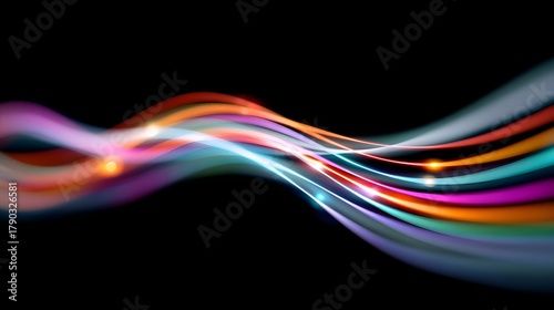 Abstract depiction of vibrant colorful light streams flowing and curving smoothly with luminous flares creating a futuristic and energetic digital motion effect on a black backdrop