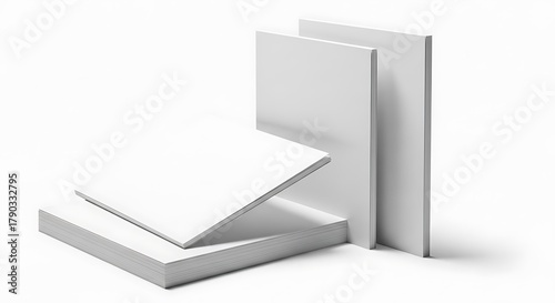 Stack of blank white paper sheets arranged neatly in studio setting for creative concept