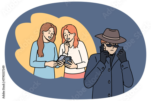 Man taps phone of women using malicious application downloaded from unverified source. Spy guy in long coat and hat taps phone with people talking, violating privacy of personal life