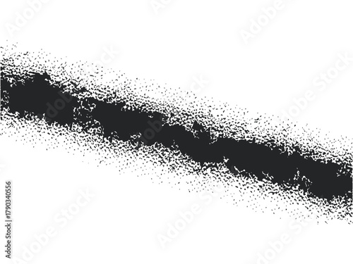 A black spray paint line on a, creating a dynamic and edgy effect