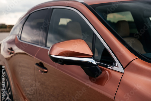 A premium, modern hybrid SUV with an elegant design, incredible color, beautiful wheels, and a large grille.