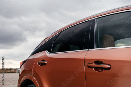 A premium, modern hybrid SUV with an elegant design, incredible color, beautiful wheels, and a large grille.