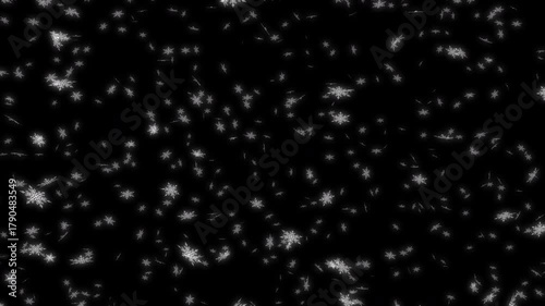 Glowing white snow falling down from top to bottom on black background while the camera moving backward. For Merry Christmas, Happy Holidays, Season's greetings, Happy Valentine's day and wedding cere