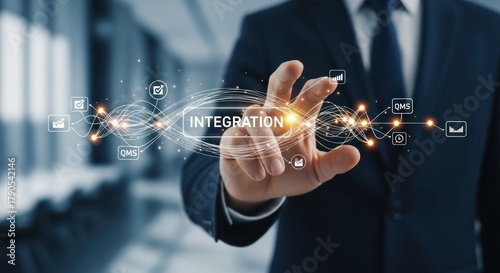 Businessman touching word integration on digital interface, for business process optimization, system connectivity, seamless workflow, strategic collaboration in modern enterprises