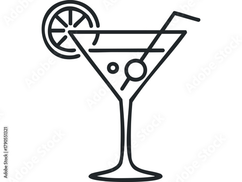 Cocktail glass with lime wedge and straw