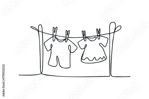 Two T-shirts drying on a clothesline