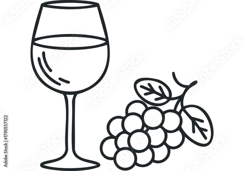 Glass of white wine and grape bunch