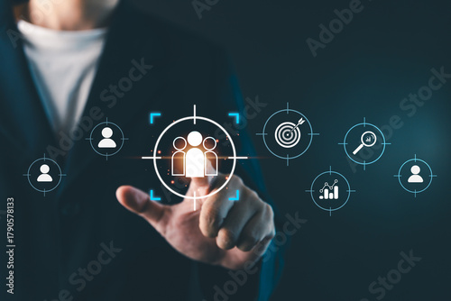 Businessman touching virtual target audience icon, digital marketing strategy concept showing customer segmentation, data analytics, and business targeting for online marketing success