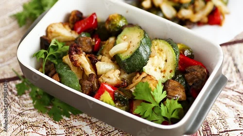 Rustic homemade meal with roasted vegetables and olive oil