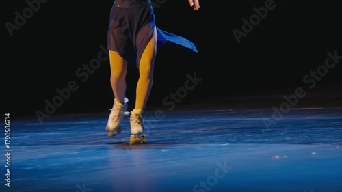 Roller Skater in White Quad Skates Performing on Blue Stage