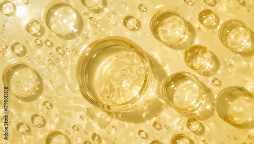 Top view of pure natural oil with bubbles jojoba coconut