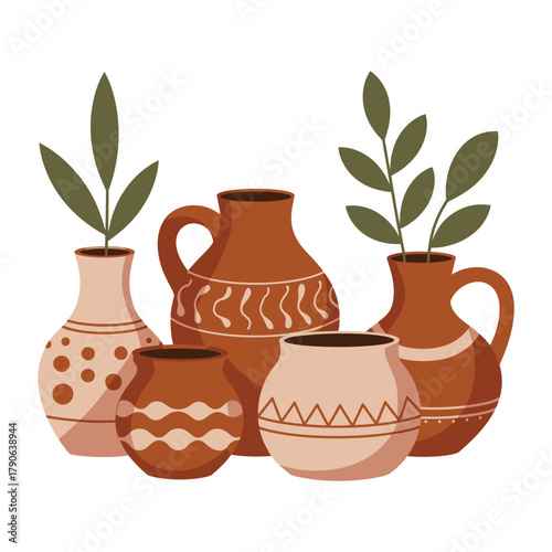 A collection of decorative ceramic vases with painted patterns and small plants.