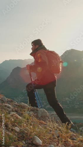 epic sunrise hike slow motion man with trekking poles cinematic mountain footage