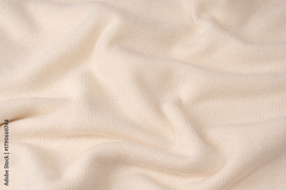 Fototapeta premium Soft milky color merino wool sweater texture as a background.