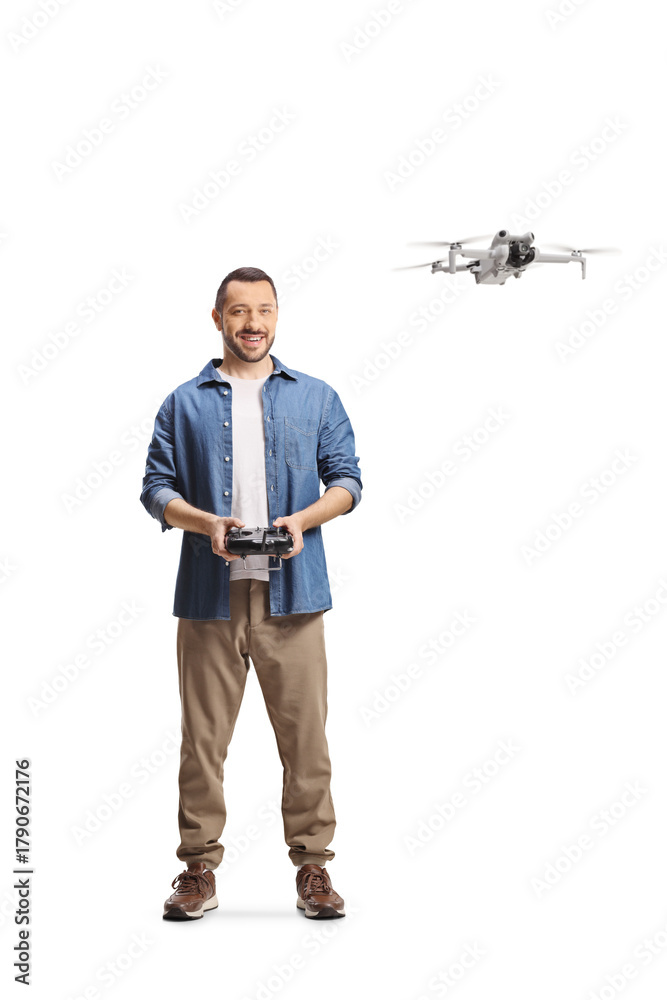 Fototapeta premium Casual man flying a drone