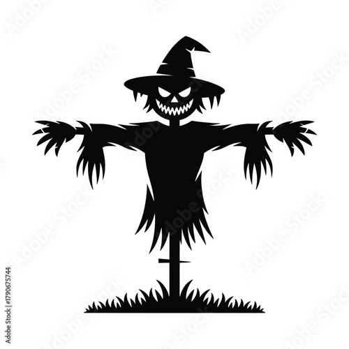 Spooky silhouette scarecrow with witch hat and grassy base