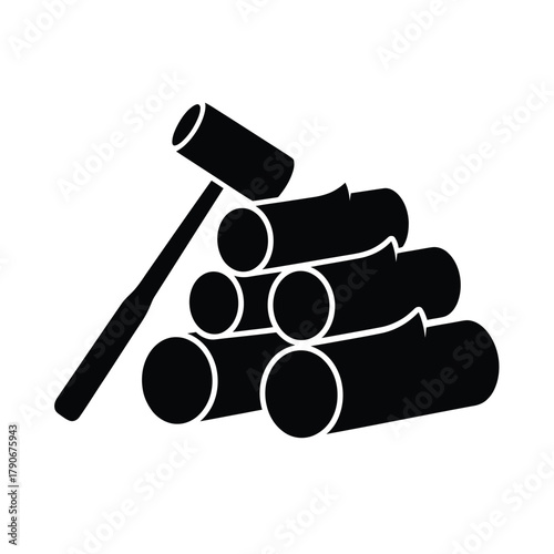 Black silhouette of firewood logs stacked with a maul