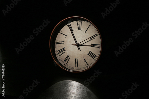 Wallpaper Mural Vintage Wall Clock with Roman Numerals and Classic Aged Design on Dark Background Torontodigital.ca
