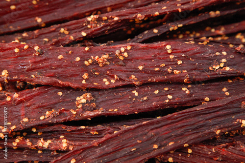 Spiced Beef Jerky Strips with Red Pepper Flakes - Traditional Air Dried Meat Snack with Artisanal Craftsmanship