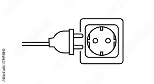 A power plug is about to be inserted into an electrical socket.