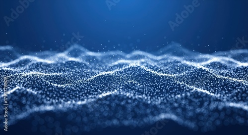 Blue digital waves made of glowing particles flow across a dark background. Perfect for tech presentations, data visualization, or modern design projects needing futuristic elements.