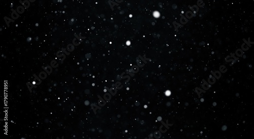 Black background with scattered white and gray dots creating a starry night sky effect. Perfect for space themes, cosmic designs, astronomy projects, or as a backdrop for presentations and graphics.
