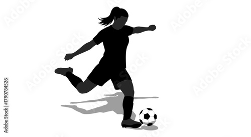 Female soccer player silhouette kicking ball with dynamic motion
