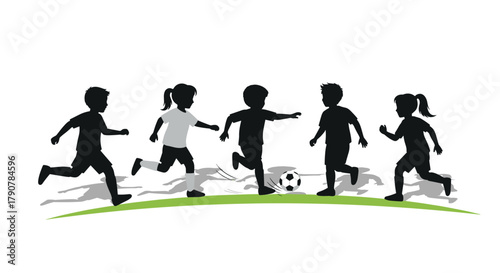 Children playing soccer silhouette on grass background