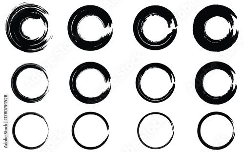 Black grunge circular brush strokes and ink ring textures, Hand-drawn black circle brush design elements, Abstract grunge ink circle shapes isolated on white background