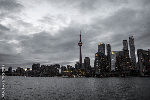 Photography oronto Skyline with CN Tower at Dusk over Lake Ontario under Dramatic Clouds