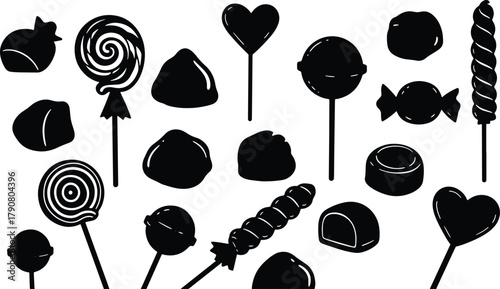 Assortment of black and white candy with lollipops and chocolates