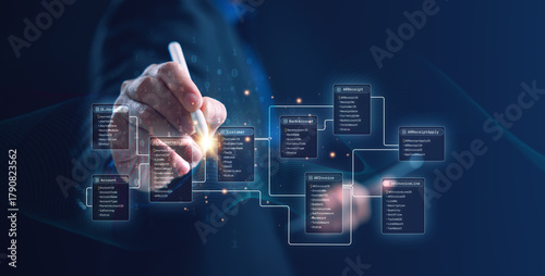 A developer using a digital interface to design an SQL database schema and entity relationship diagram (ERD) with connected tables. Perfect for data engineering, system design, and IT concepts.