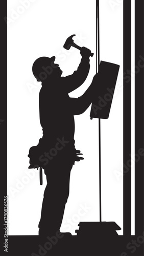 Skilled craftsman silhouette with hammer and tool belt at work