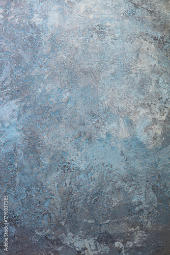 Abstract blue-gray wall texture resembling natural stone. Copy space. Top view.
