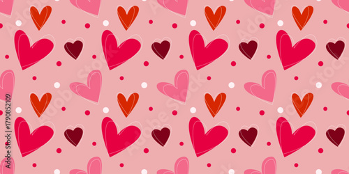 Seamless vector pattern with red, pink, and coral hearts on pastel background. Simple flat design for Valentine’s Day theme in minimal geometric style