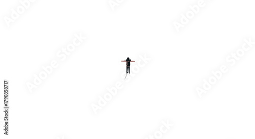 A Person Silhouette With Arms Outstretched Against a Dark Black Background