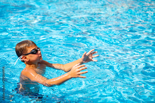 happy boy swimming in the pool