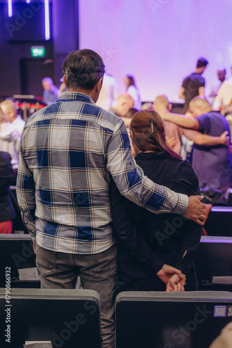 A Group of Christians pray to bless and pray for each other in church