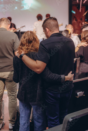 A Group of Christians pray to bless and pray for each other in church